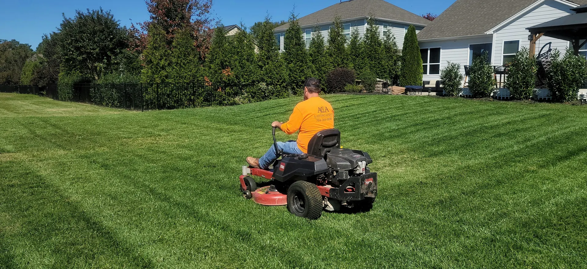 Lawn Maintenance professional working at a customer property